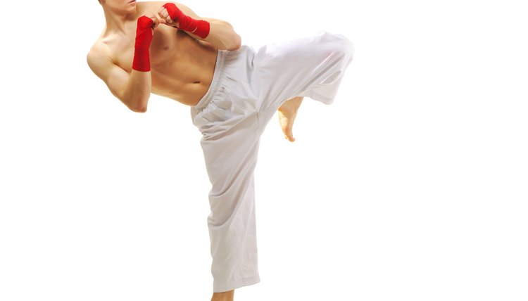 Man training taekwondo Isolated on white background