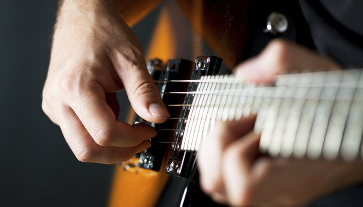 Man playing country-western music.