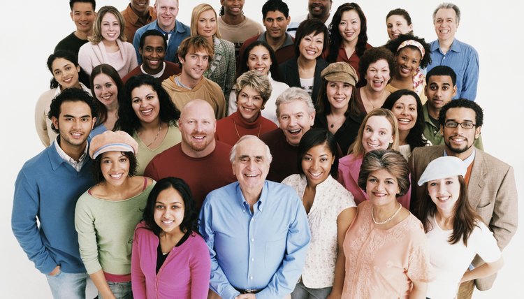 Studio Shot of a Large Mixed Age, Multiethnic Group of Smiling Men and Women