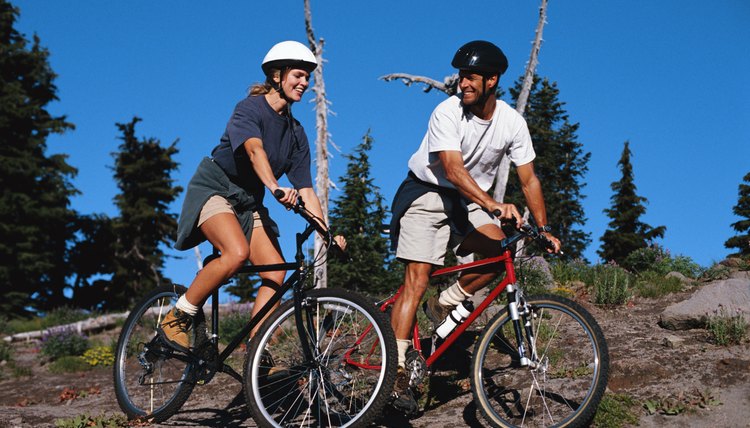 Couple Riding Mountain Bikes