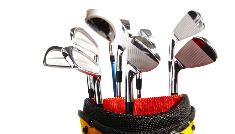 Golf clubs against white background