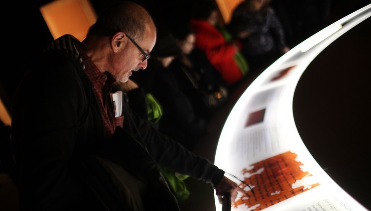Patrons view the oldest parchment scroll of the Ten Commandments on exhibit in New York.