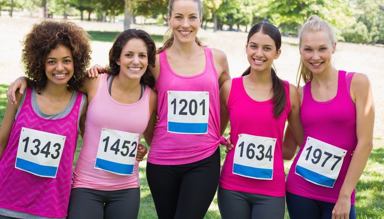 Confident women participating in breast cancer marathon