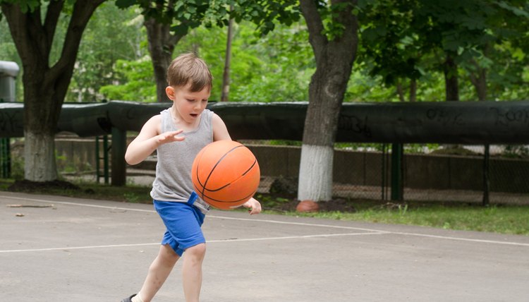 Young boy playing basketball