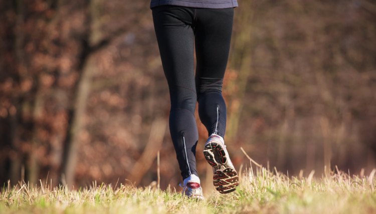 Young woman running outdoors in a city park