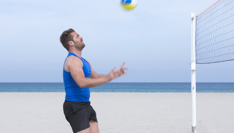 male player playing beach volley