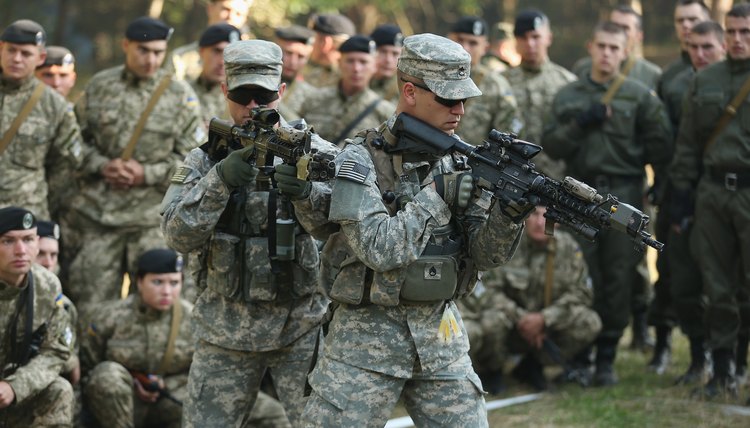 U.S. army soldiers demonstrating military techniques.