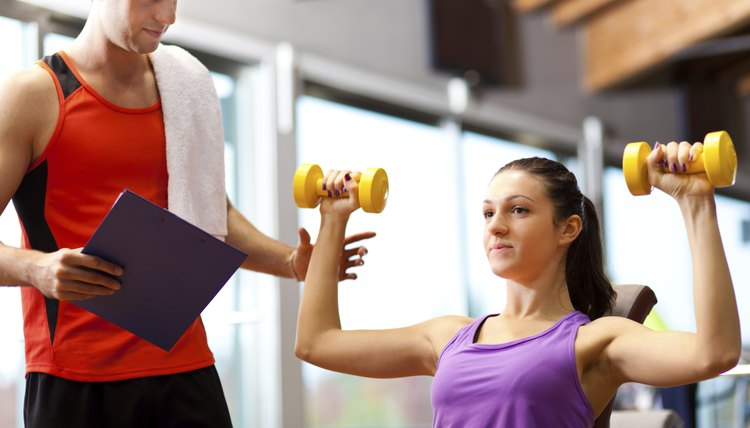 Young woman lifting weights