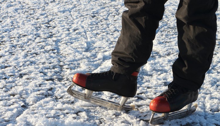 Male feet in the skates on a snow surface