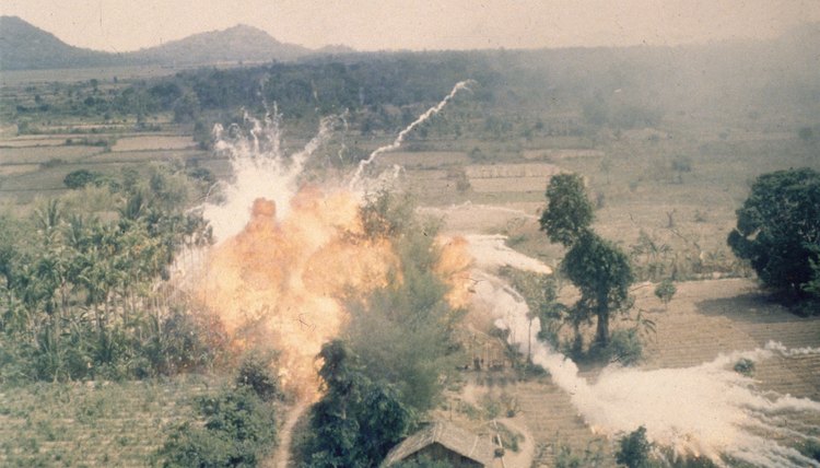 A napalm bomb explodes during a strike south of Saigon during the Vietnam War