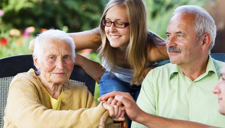 High schooler visiting with elderly