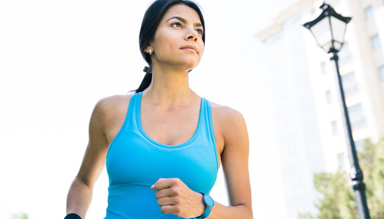 Sports woman running outdoors