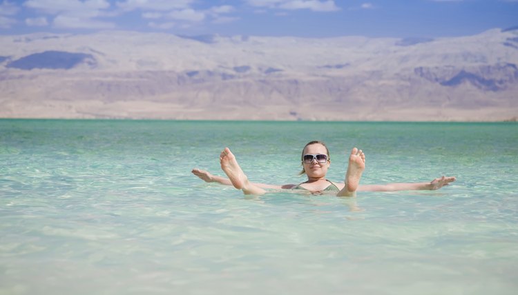 Woman floating in the Dead Sea