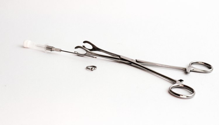 Piercing needle and supplies.