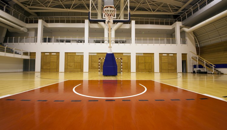 Below the basket on a gymnasium