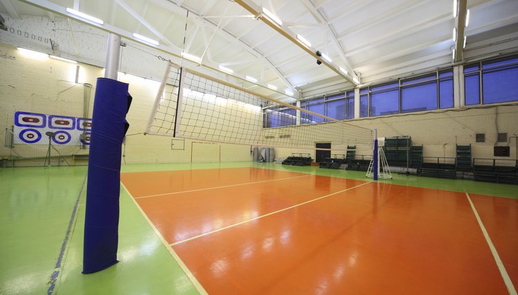 Volleyball net inside lighted school gym hall