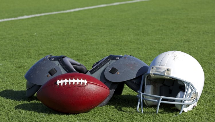 American Football and Helmet on the Field