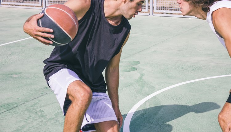 Men playing basketball