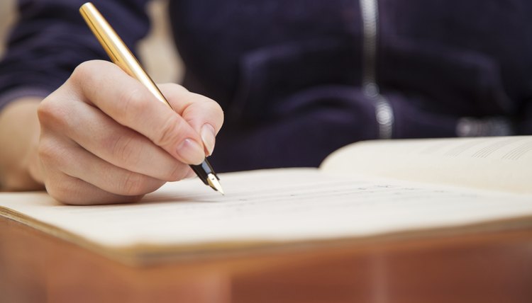 A man takes notes.