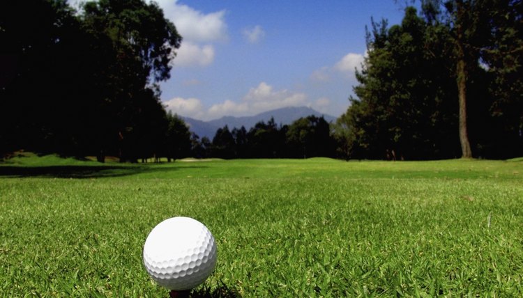 Golf ball on tee on golf course