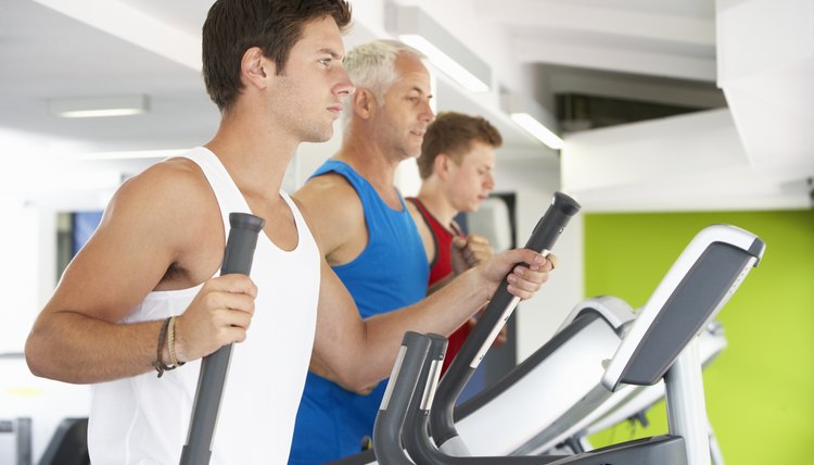 Group Of People Using Different Gym Equipment