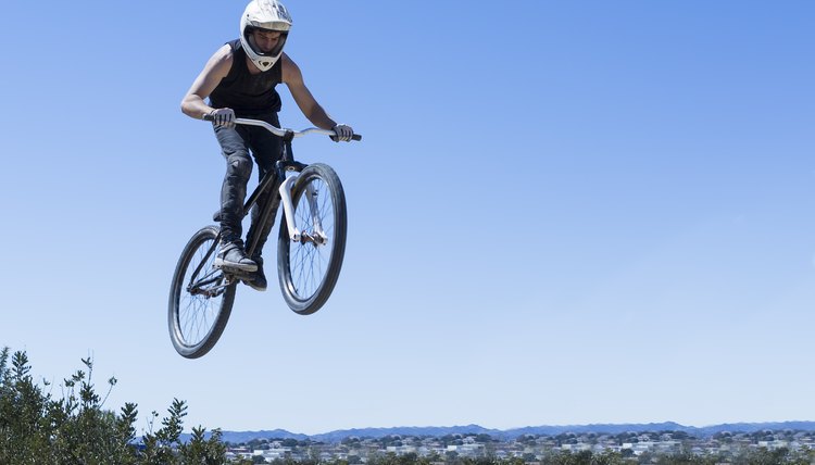 BMX rider jumping with bike