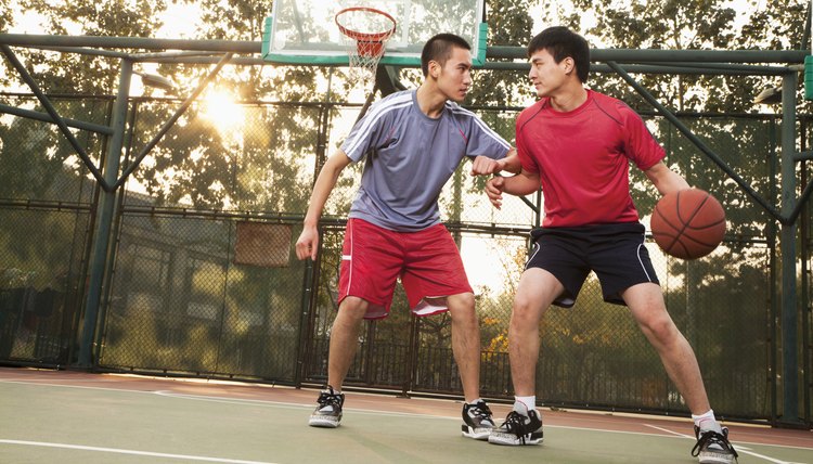 Two street basketball players on the basketball court