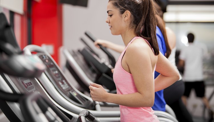 Beautiful brunette on a treadmill