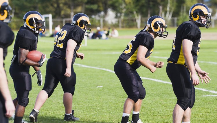 Football players playing in a field