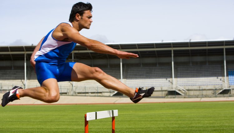 Man jumping a hurdle