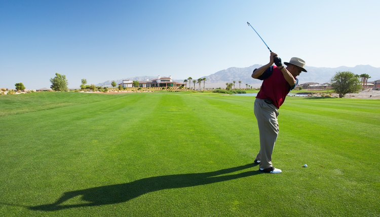 Golfer swinging golf club, Las Vegas, Nevada