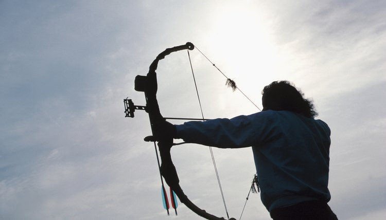 Silhouette of man with bow and arrow