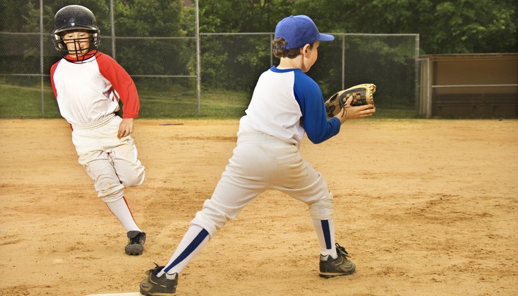 Young boys playing in baseball game