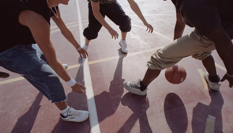 Teenagers playing basketball