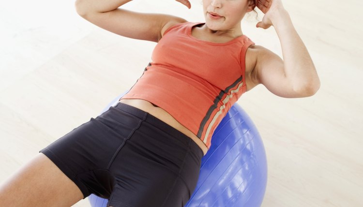 Elevated view of a young woman working out on an inflatable ball