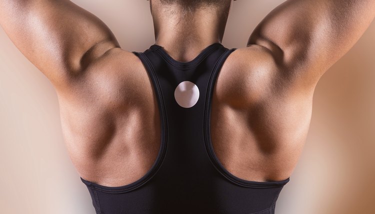 Woman's back in the fitness room.