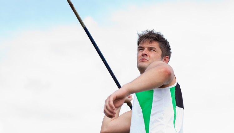 Determined sportsman throwing the javelin