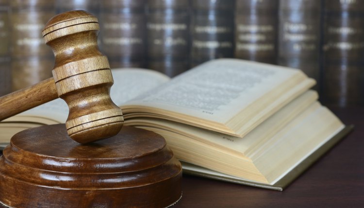 Close-up of legal gavel and law books.