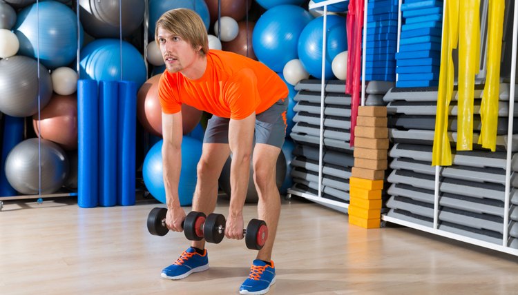 dumbbell deadlift blond man at gym weightlifting