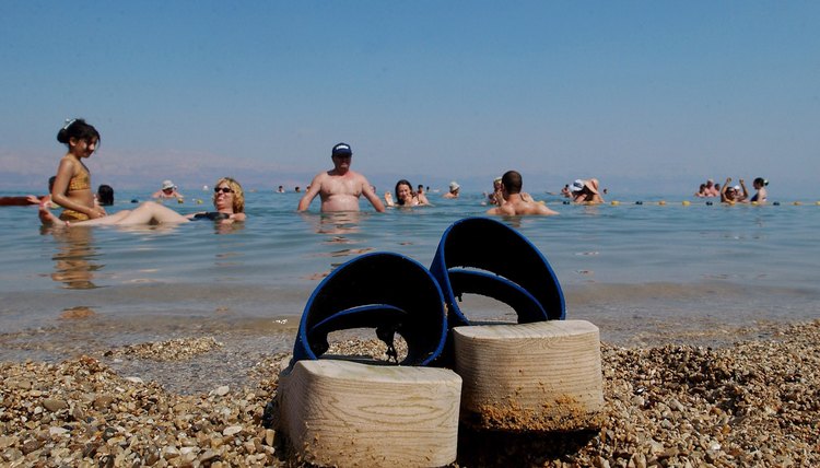 Tourists float in the Dead Sea area of the West Bank
