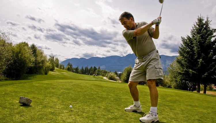 Golfer taking his first shot