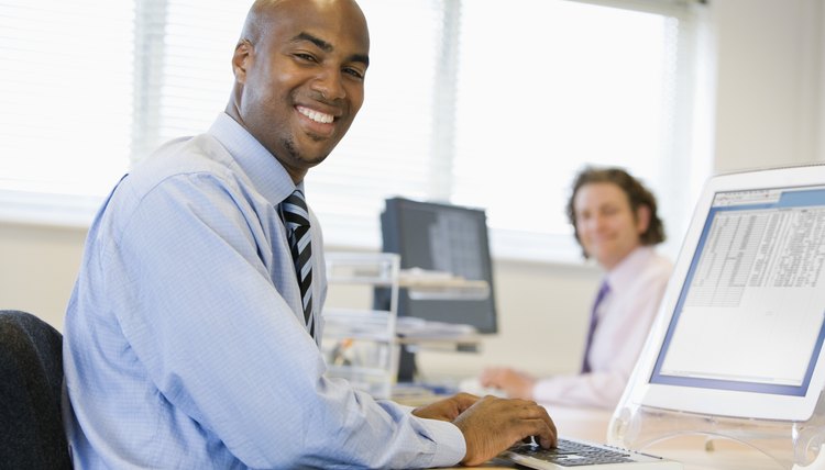 Businessmen working at desks