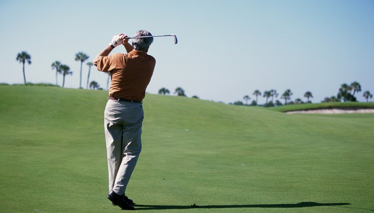 Rear view of a man playing golf