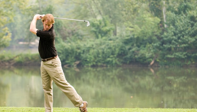 Ask a friend or fellow golfer to take a couple video shots of you taking a full swing at the range or on the course to correct a problem.