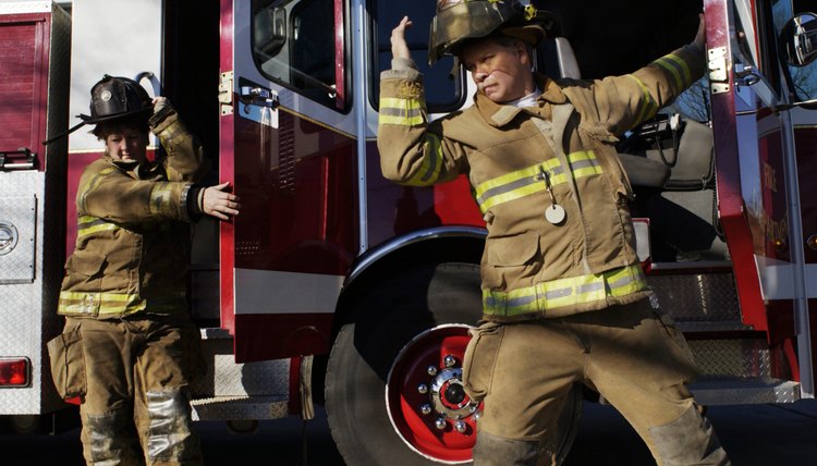 Firefighters getting out of fire truck