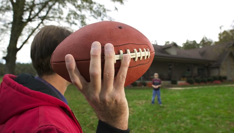 Father and son playing football