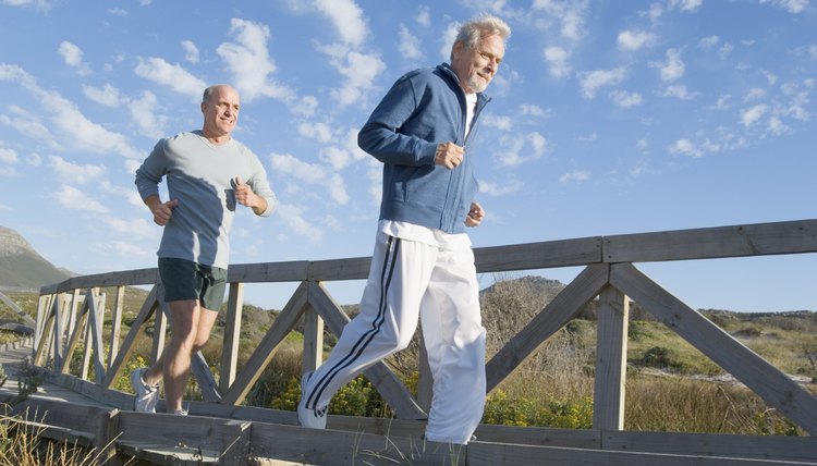 Men jogging on bridge