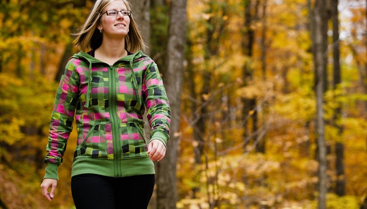 Woman walking in forest