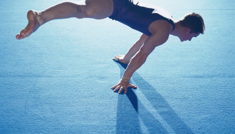 Male Gymnast Balancing During Floor Routine