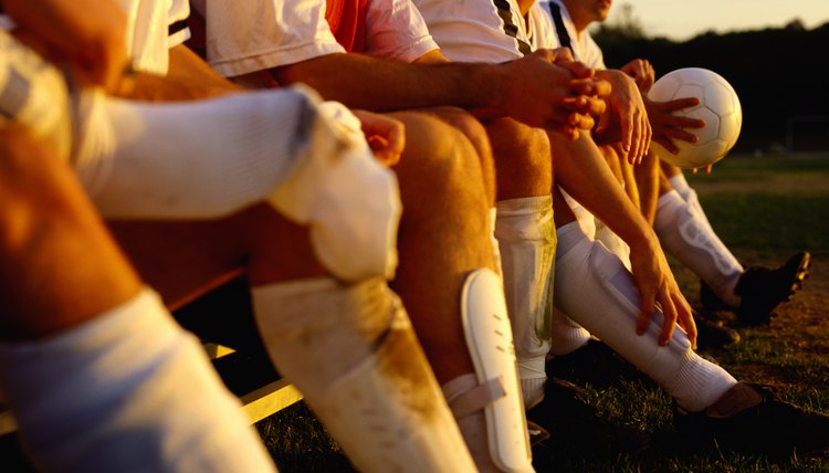 Soccer Team Sitting on a Bench